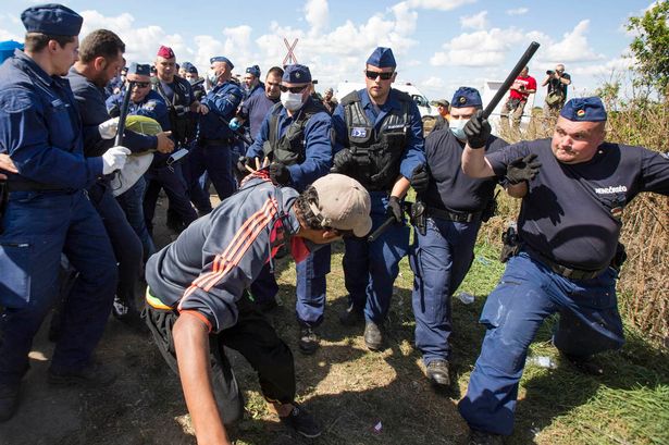Hungarian-police-and-refugees-clash